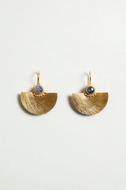 The Hand Crafted Gold Labradorite Fan Earrings feature gold fan drops with a semi-precious labradorite gemstone set above each half-circle, displayed against a neutral background.
