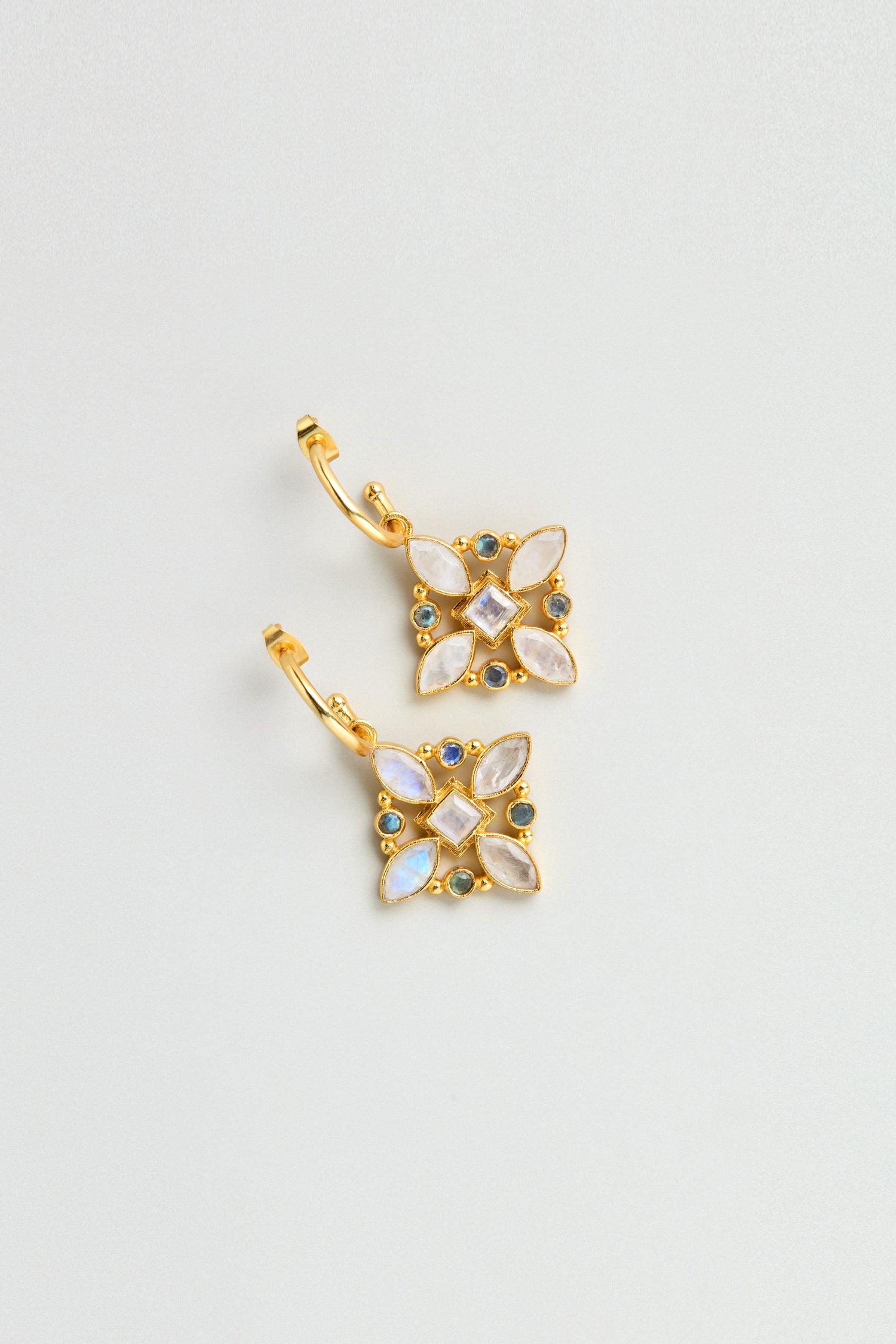 A pair of Hand Crafted Moonstone Labradorite Decorative Earrings, featuring a square floral design with white and blue gemstones, displayed on a light background.