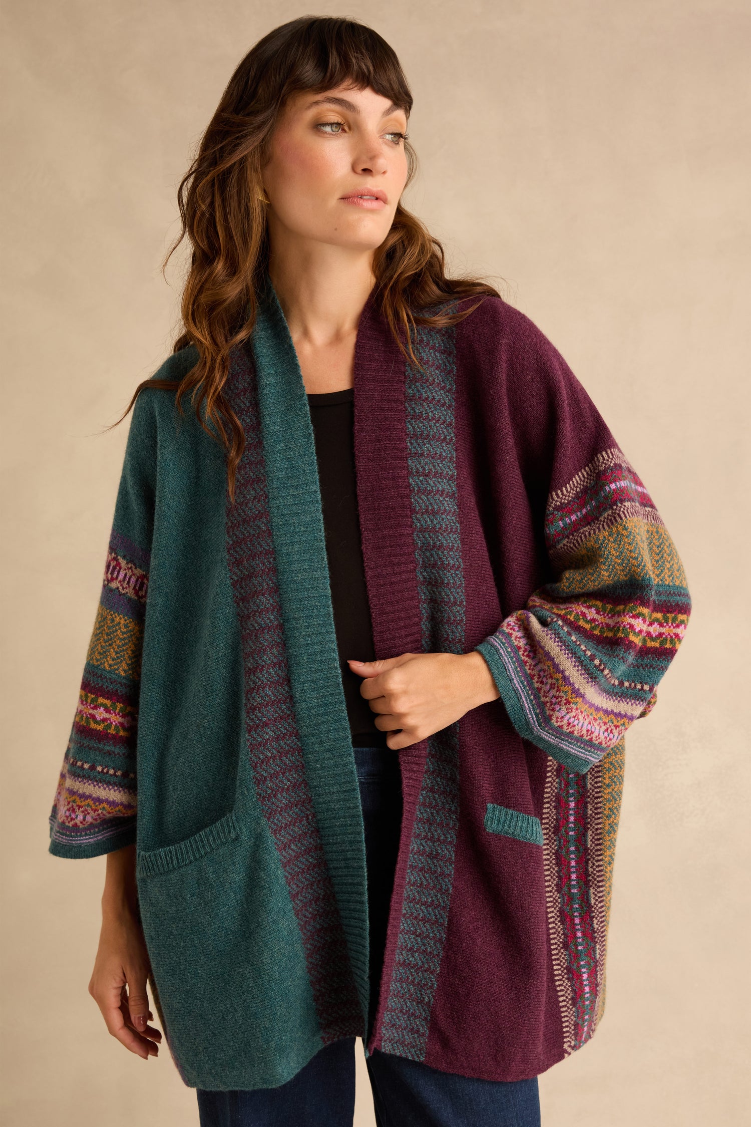 Hunter Montrose Blanket Cardigan in a color-blocked teal and purple design, featuring Fair Isle patterned sleeves and patch pockets.