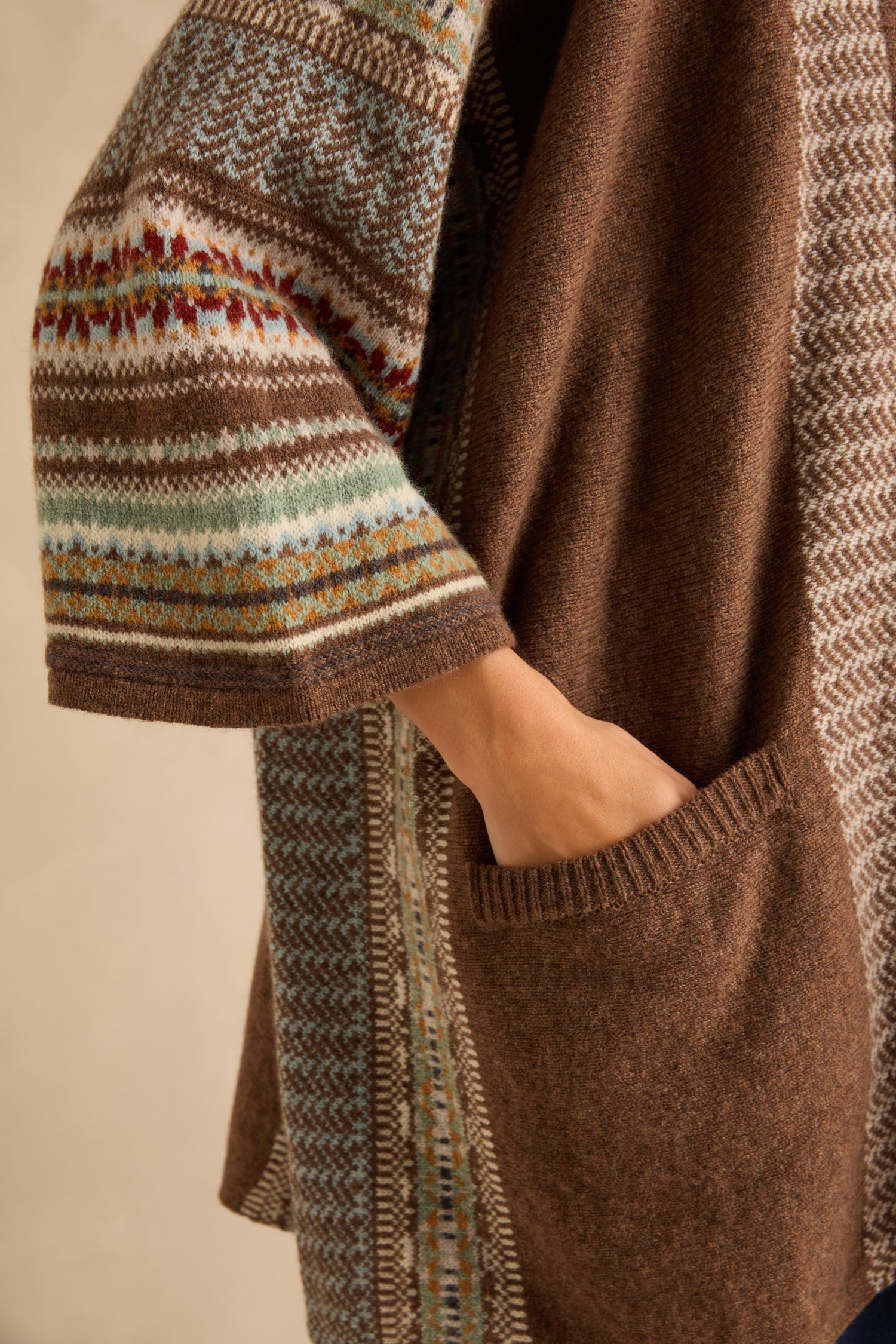 Close-up of a Mushroom Montrose Blanket Cardigan, featuring patterned Fair Isle sleeves and a large patch pocket.
