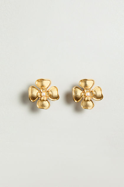 The Gold Plated Flower Pearl Earrings feature a floral design with a delicate pearl center, shown against a plain light background.