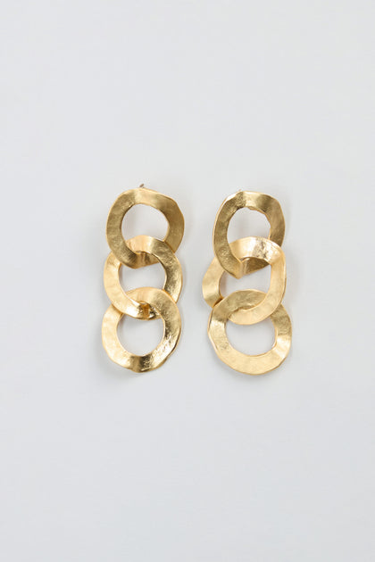 Gold Triple Hoop Earrings featuring three interlocking, textured gold hoops per earring, displayed against a plain light background—these statement drop earrings are the perfect accessory to elevate any look.