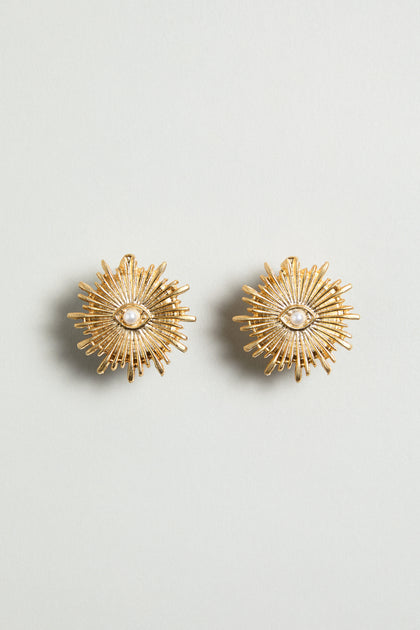Gold Plated Luna Pearl Earrings featuring a sunburst design with a delicate pearl center, shown on a plain light background.