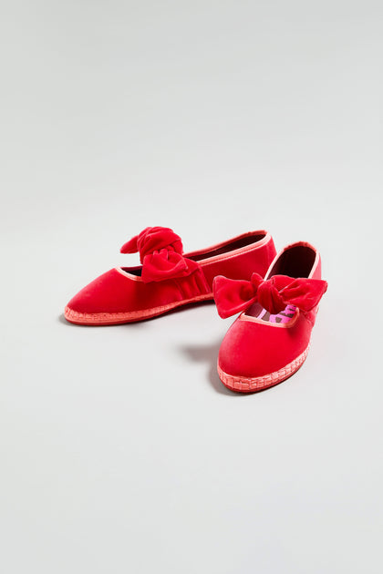 A pair of Strawberry Pink Lyra Bow Velvet Shoes with bows and woven soles, displayed on a plain light background.