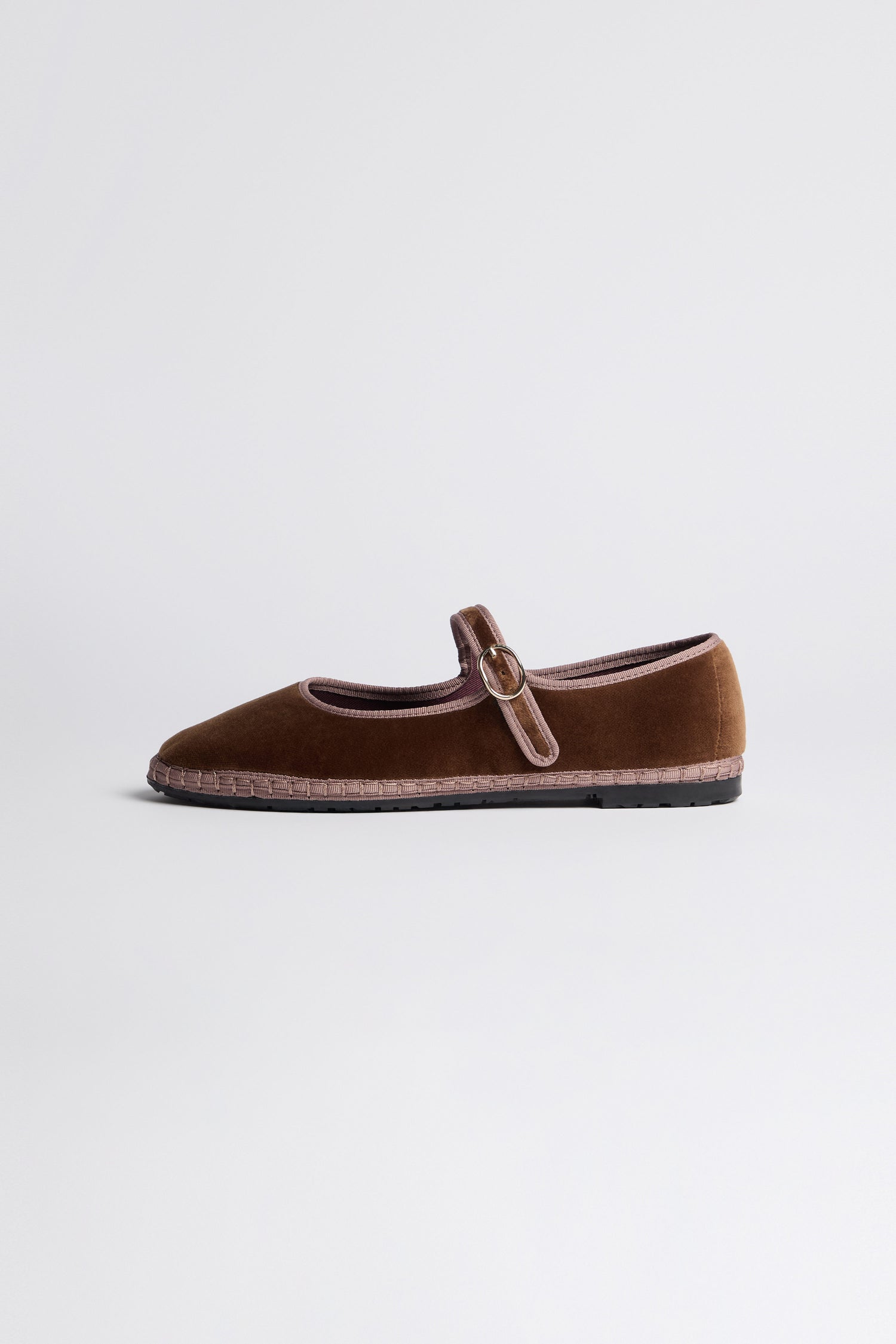 Brown Mary Jane Velvet Shoes feature a single strap with buckle, vintage-inspired design, and sustainable craftsmanship, shown against a plain light background.