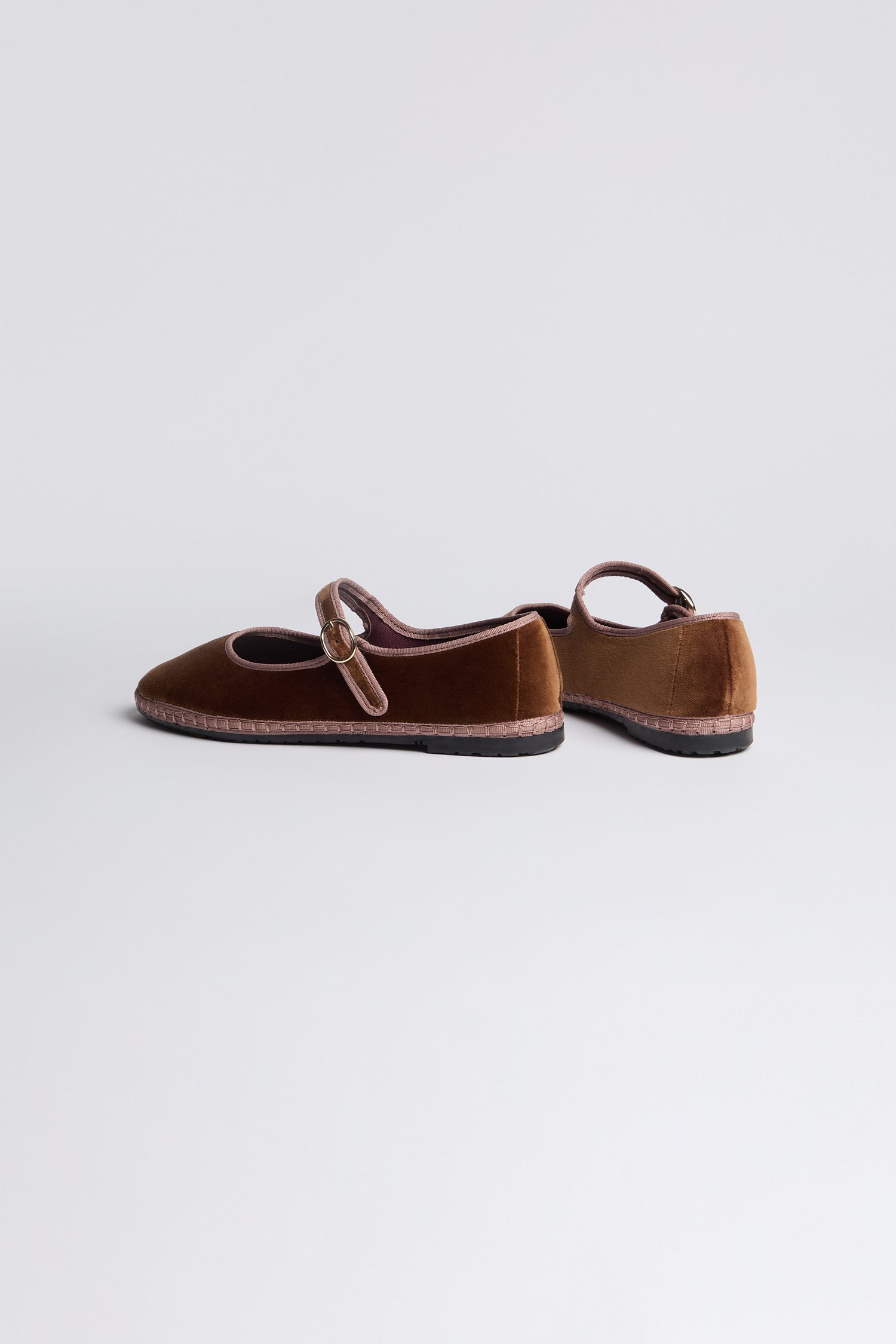 Brown Mary Jane Velvet Shoes with pink trim and a decorative buckle are displayed on a light gray background, offering vintage charm.