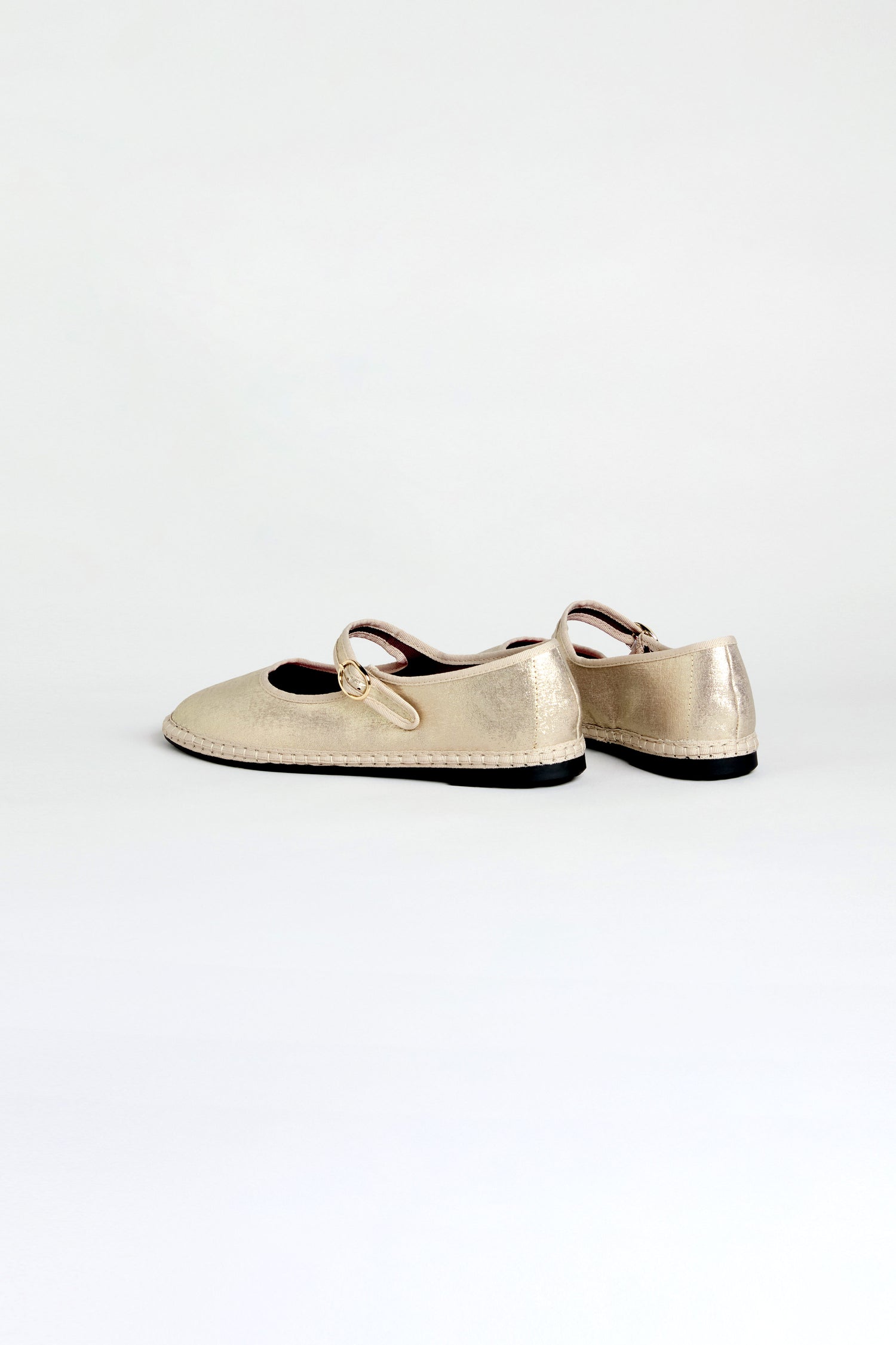 Metallic Mary Jane Shoes, handmade in Spain with recycled bicycle tyre soles and a small buckle strap, displayed on a plain white background.