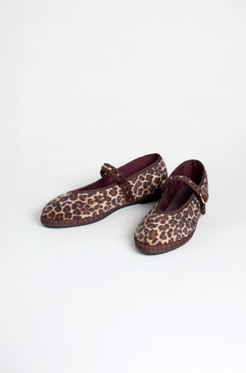 Cheetah Mary Jane Shoes with maroon straps and trim, made with a recycled bicycle tyre sole, are displayed on a plain light background.
