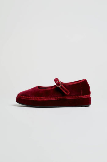 A single Wine Velvet Platform Mary Jane Shoe, featuring a round toe, a platform sole, and a strap secured with a small buckle—handcrafted in Spain—is displayed in profile against a plain light background.