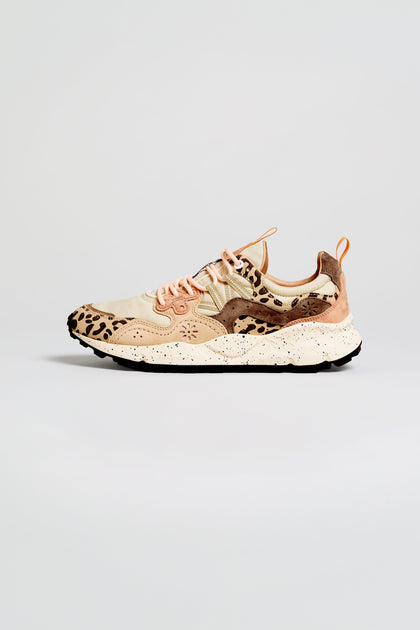 Showcased on a neutral background, the Yamano 3 Cheetah Detail Trainers feature tan suede uppers with black cheetah print accents, light brown and cream overlays, beige laces, and a chunky white sole for a stylish finish.