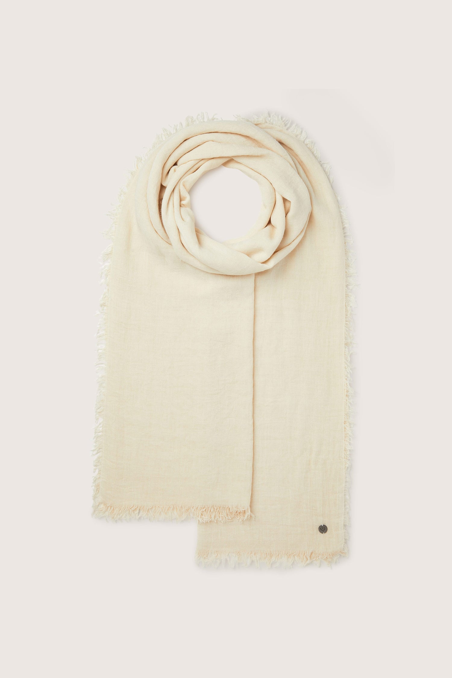 This Soft Fringe Scarf has fringes made of a soft, textured material, offering versatile styling options on a white background.