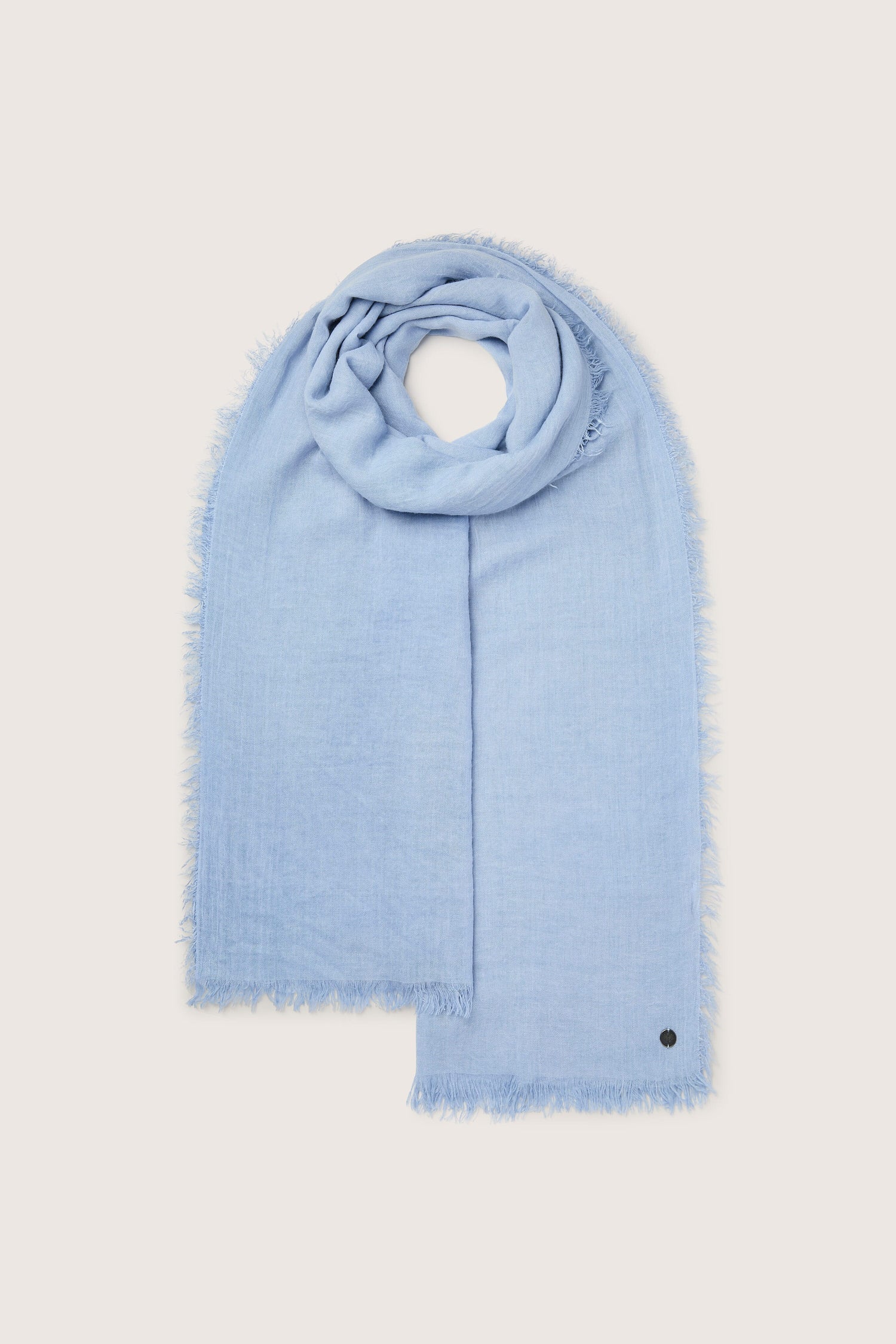 Sentence with the replaced product name: Blue Soft Fringe Scarf with frayed edges displayed on a white background, a must-have accessory.