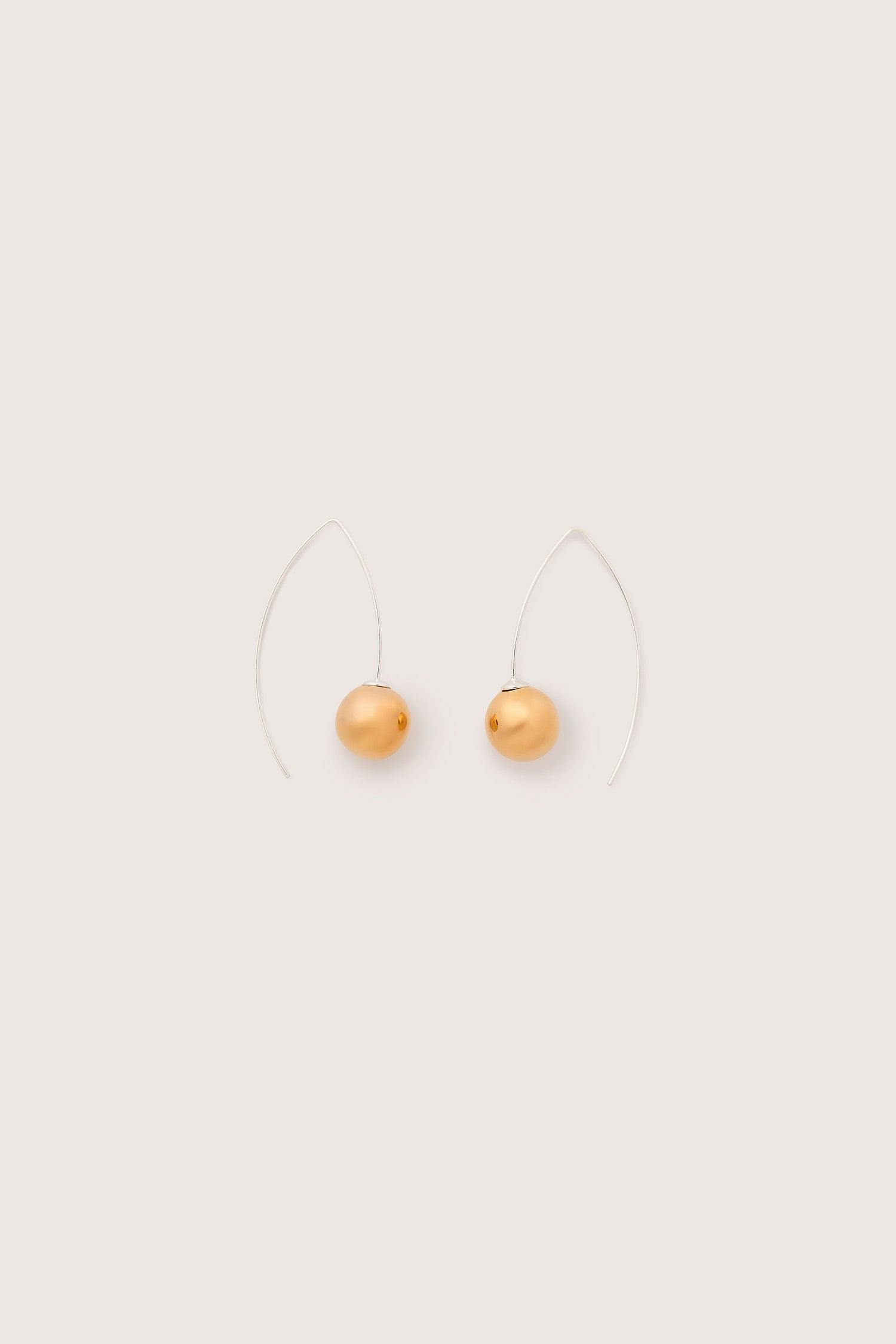 A pair of Handmade Ceramic Mirror Earrings, each adorned with an oval-shaped gold bead and set against a plain light background. These modern design pieces feature 925 sterling silver hooks for added elegance.