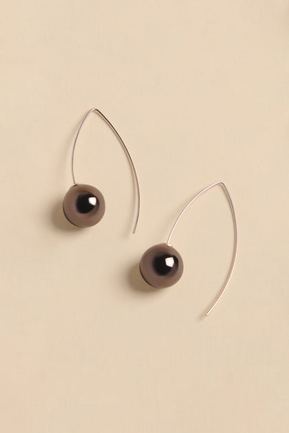 Handmade Charcoal Ceramic Bead Earrings featuring two dark charcoal-colored ceramic beads on thin silver curved wires.