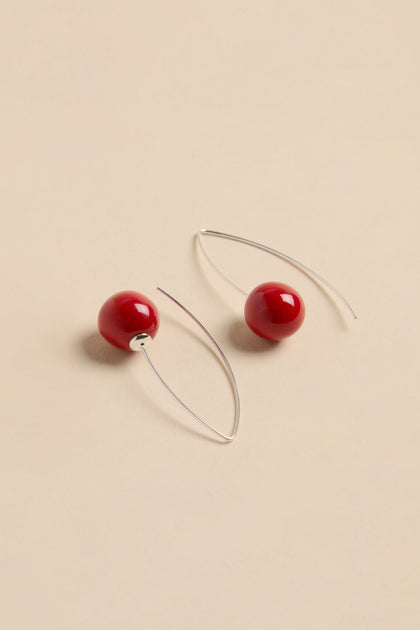 Handmade Deep Red Ceramic Bead Earrings featuring round red ceramic beads on silver wire hooks.