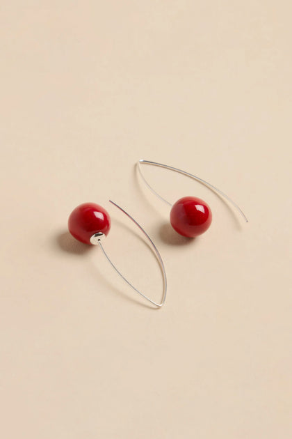 Handmade Deep Red Ceramic Bead Earrings featuring deep red ceramic beads on silver curved wire hooks.