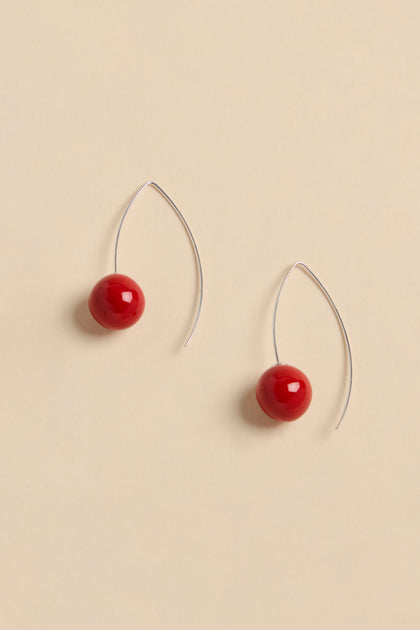 Handmade Deep Red Ceramic Bead Earrings featuring red spherical ceramic beads on curved silver-tone wires.