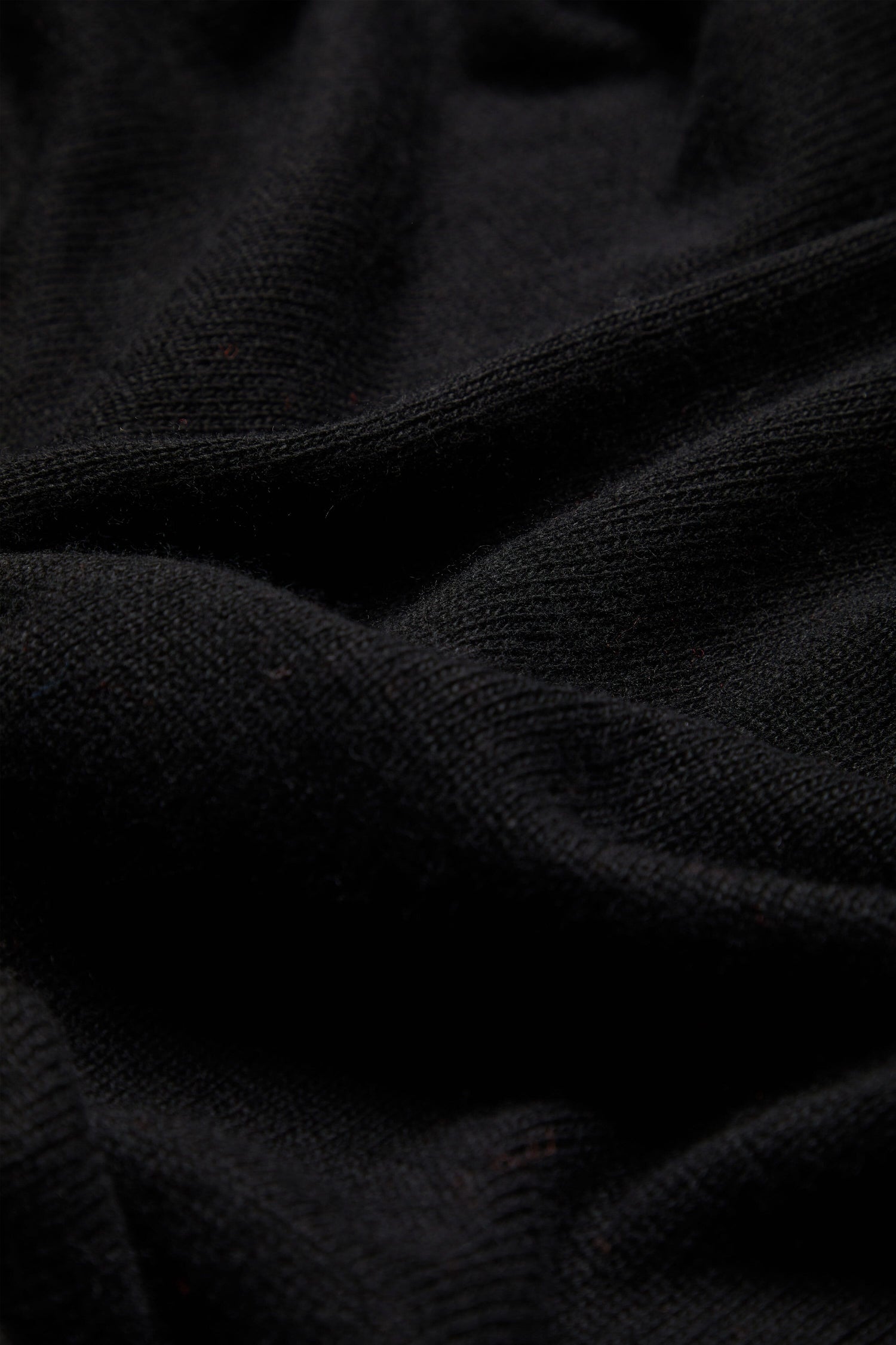 A close up of a black Cashmere Merino Crop Jumper.