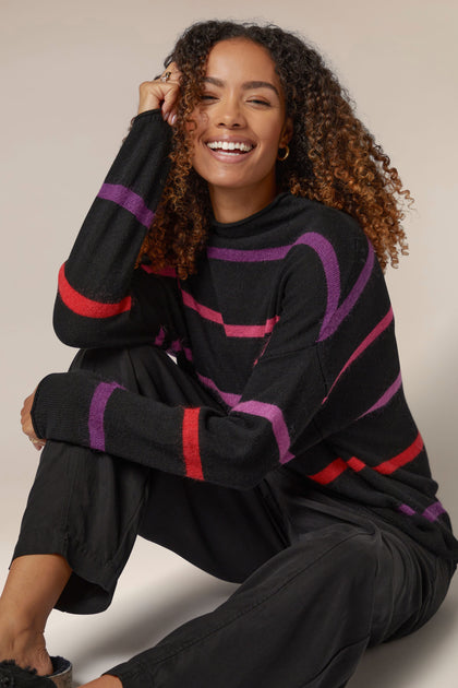 A woman wearing a Mohair Blend Stripe Sweater.