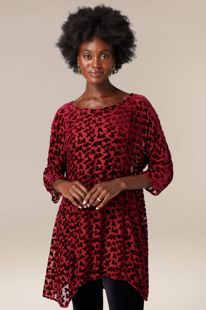 A woman wearing a Grizas burgundy Devore Tunic.