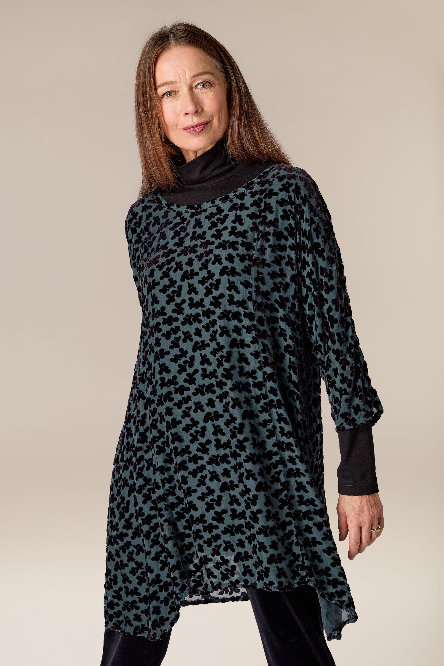 A woman wearing a Devore Tunic made from a burned-out velvet textile.