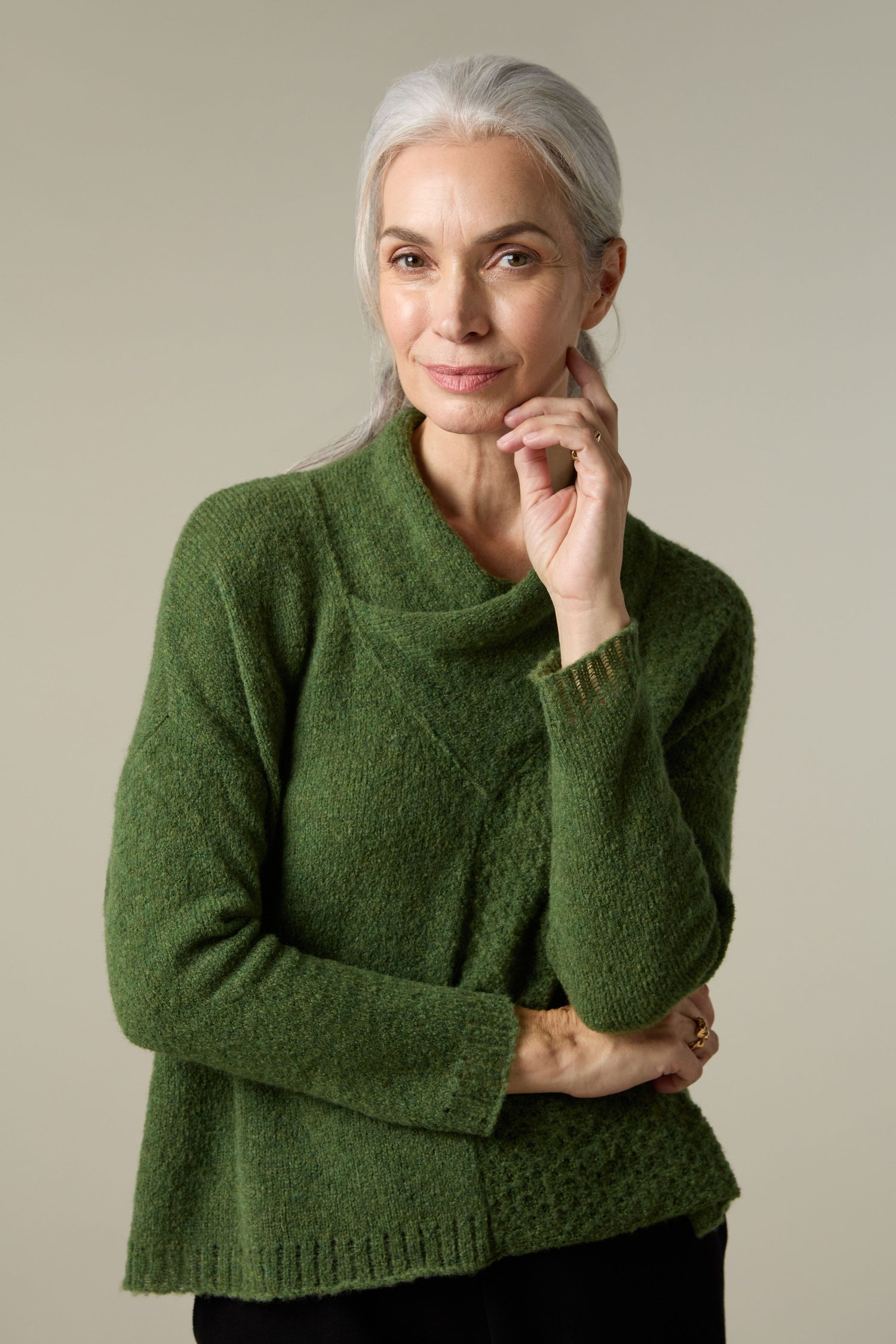 A woman wearing a Grizas Panel Knit, showcasing a plush knit for a cosy layering look.