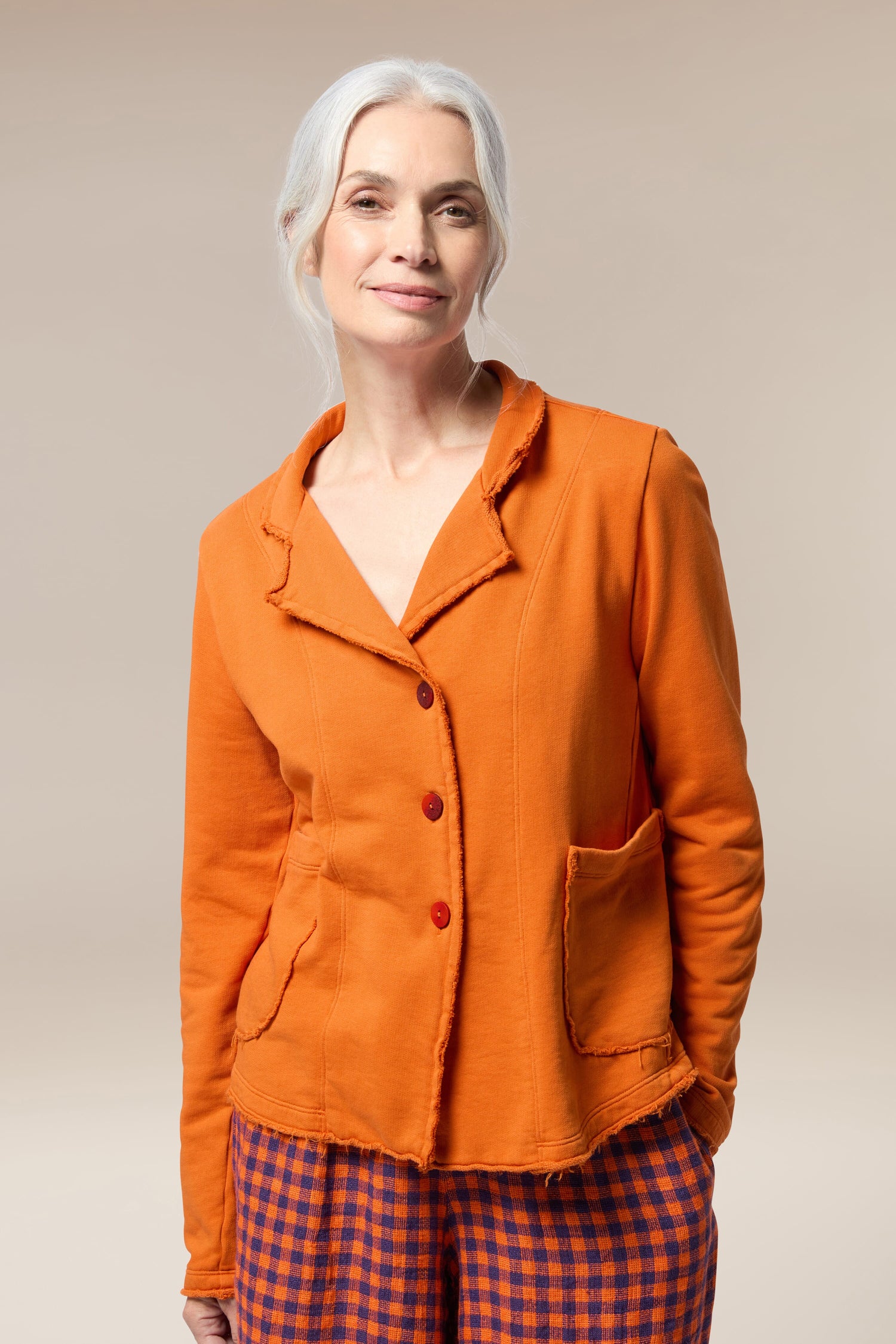 A woman wearing a tailored Collar Jacket for her summer wardrobe.