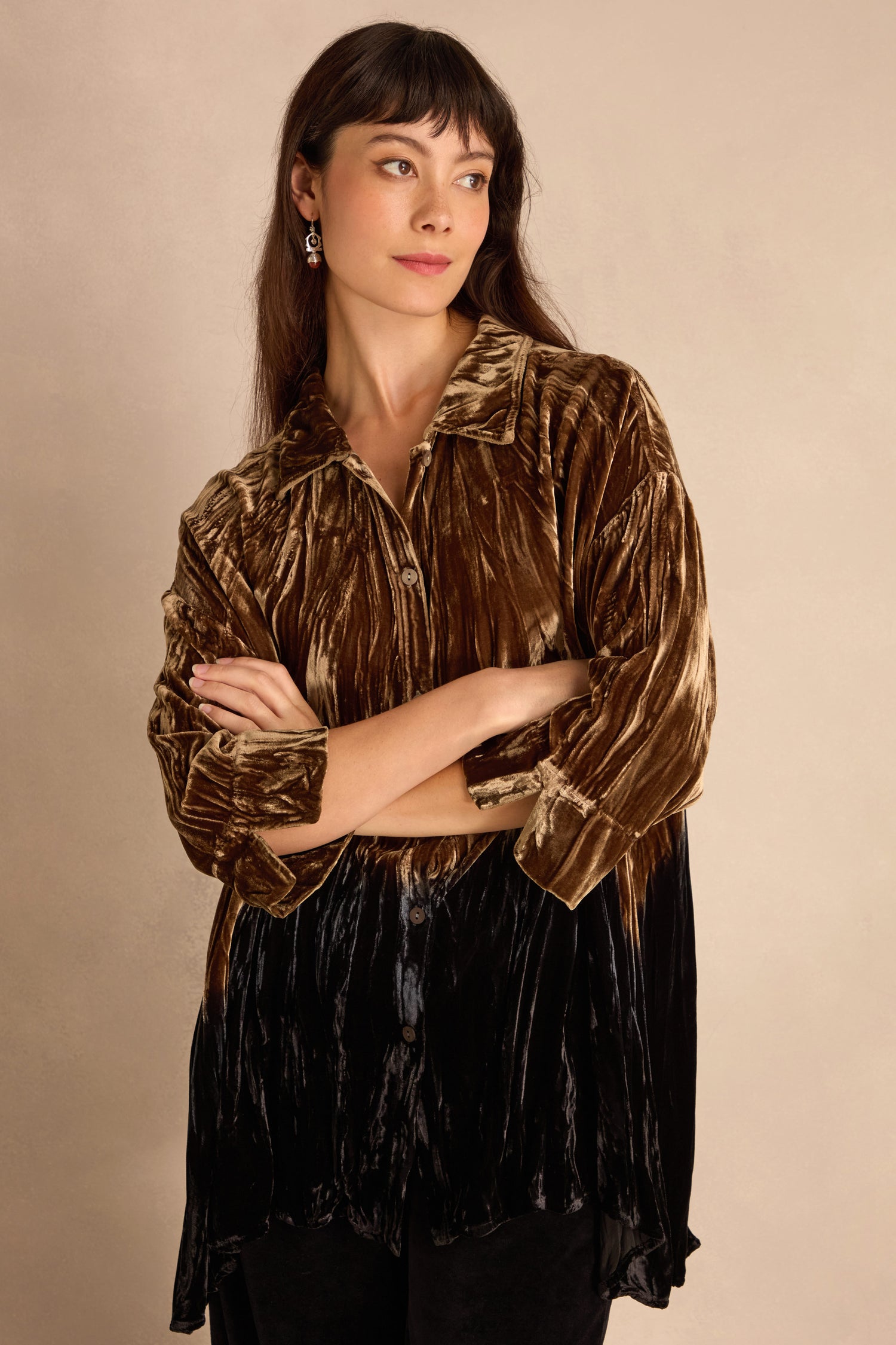 Woman wearing the Olive Silk Velvet Ombre Shirt, arms crossed, looking to the side against a plain beige background.