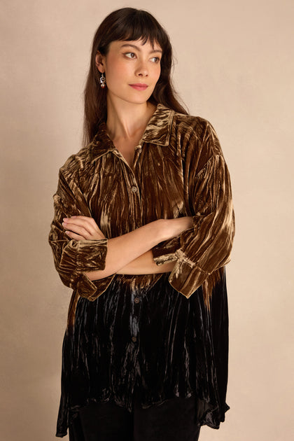 Woman wearing the Olive Silk Velvet Ombre Shirt, arms crossed, looking to the side against a plain beige background.