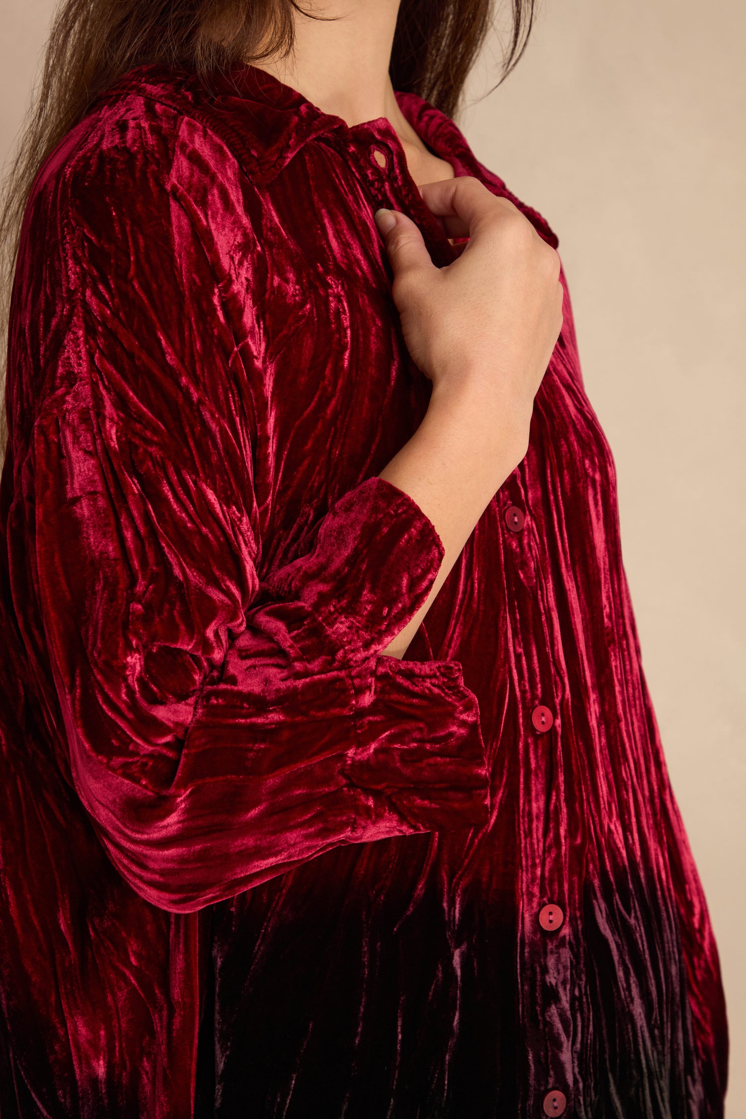 A person wearing a Ruby Silk Velvet Ombre Shirt holds the collar with one hand.