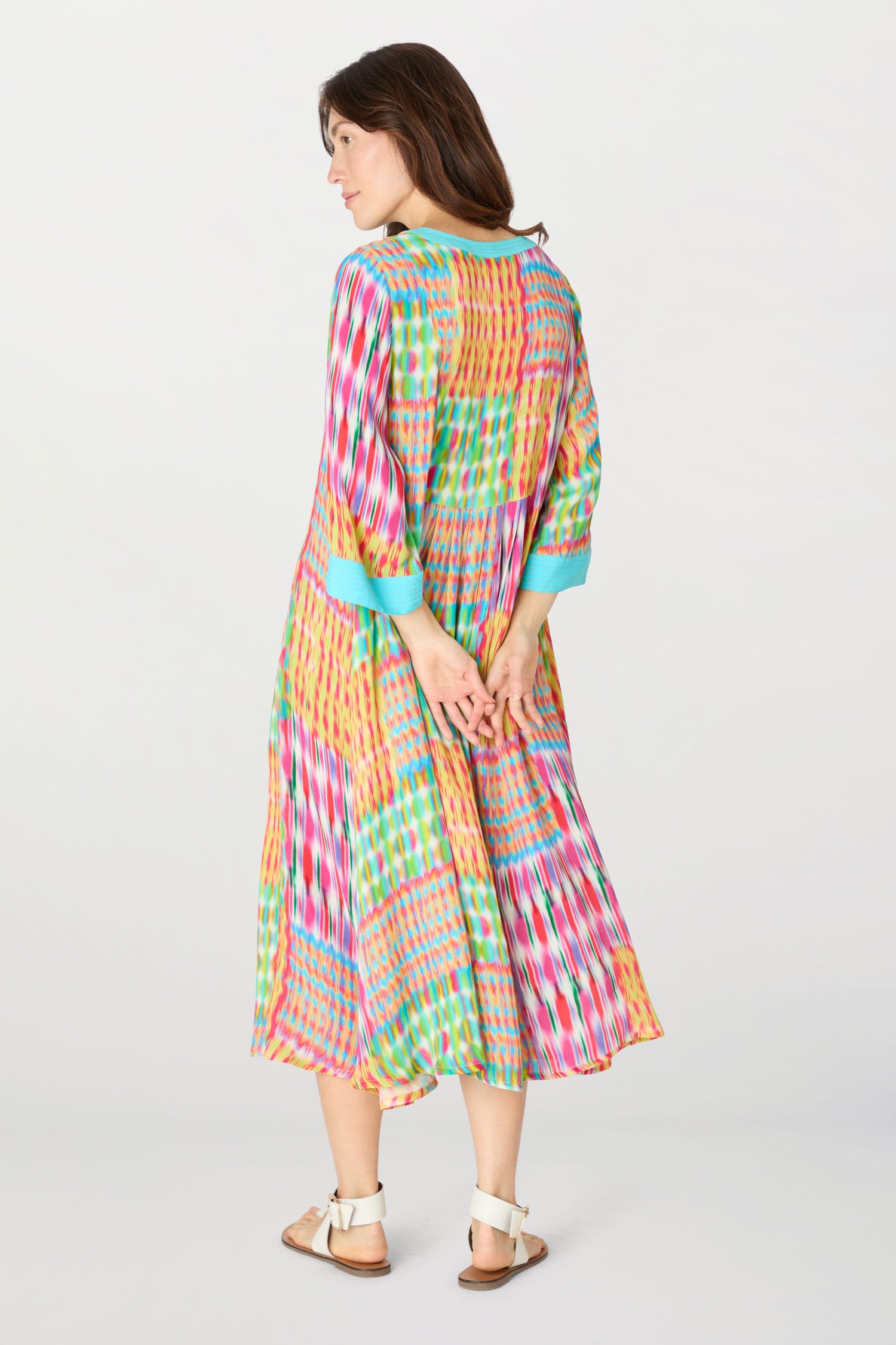 The back view of a woman wearing the Kaleidoscope Ikat Flare Dress.