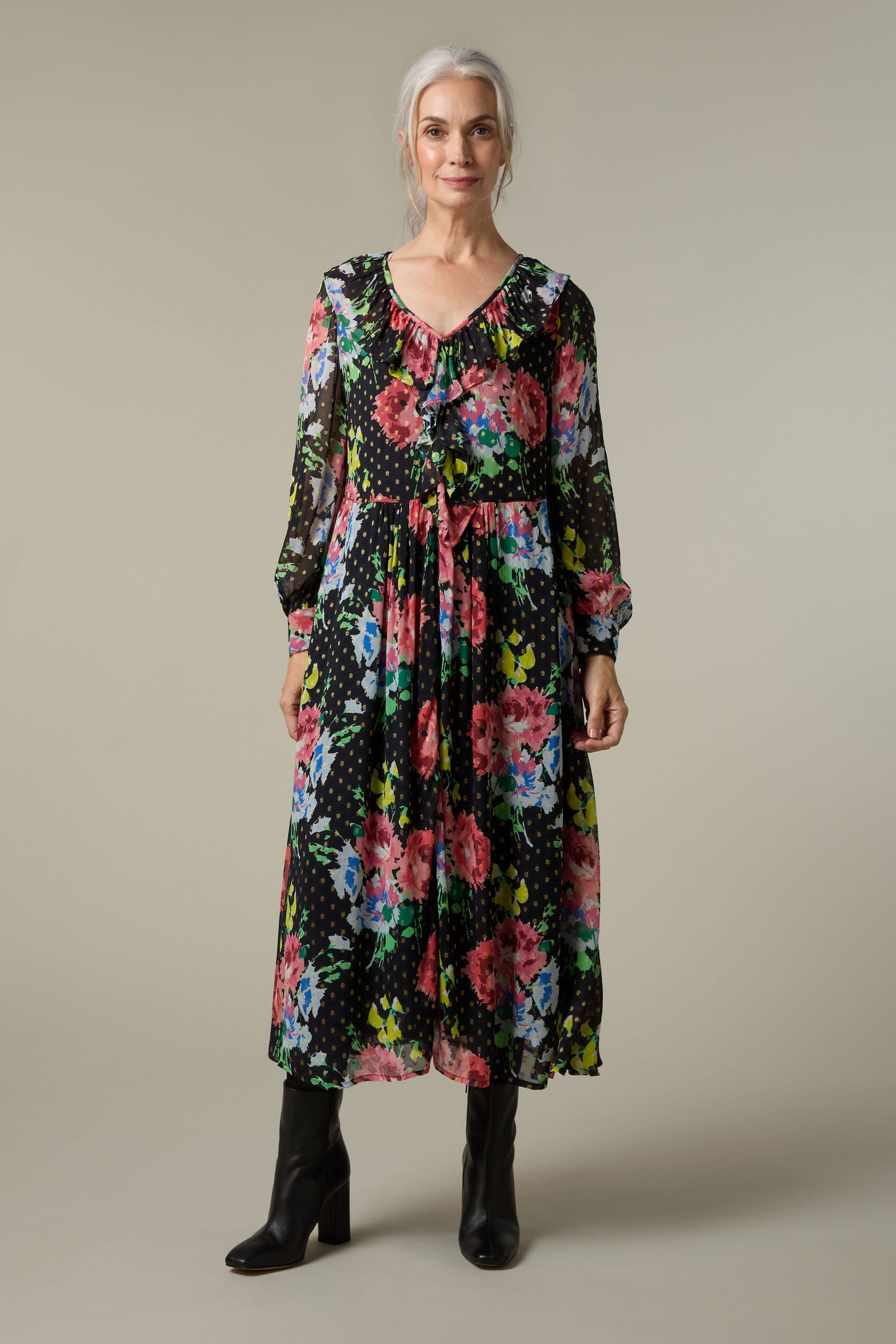 A woman wearing a Floral Bouquet Frill Dress.