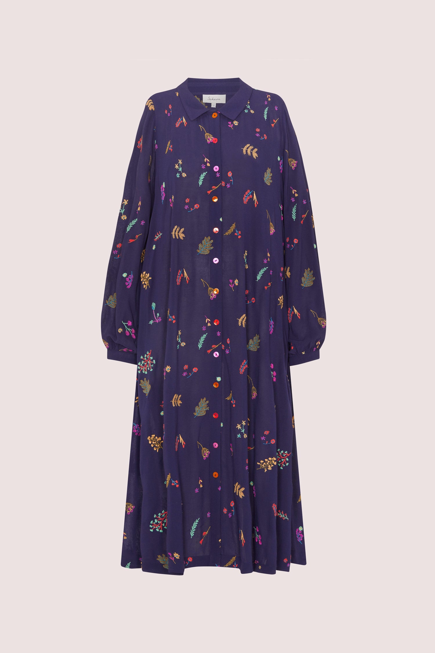 A Winter Sprig Crepe Shirt Dress adorned with vibrant embroidery featuring colorful florals.