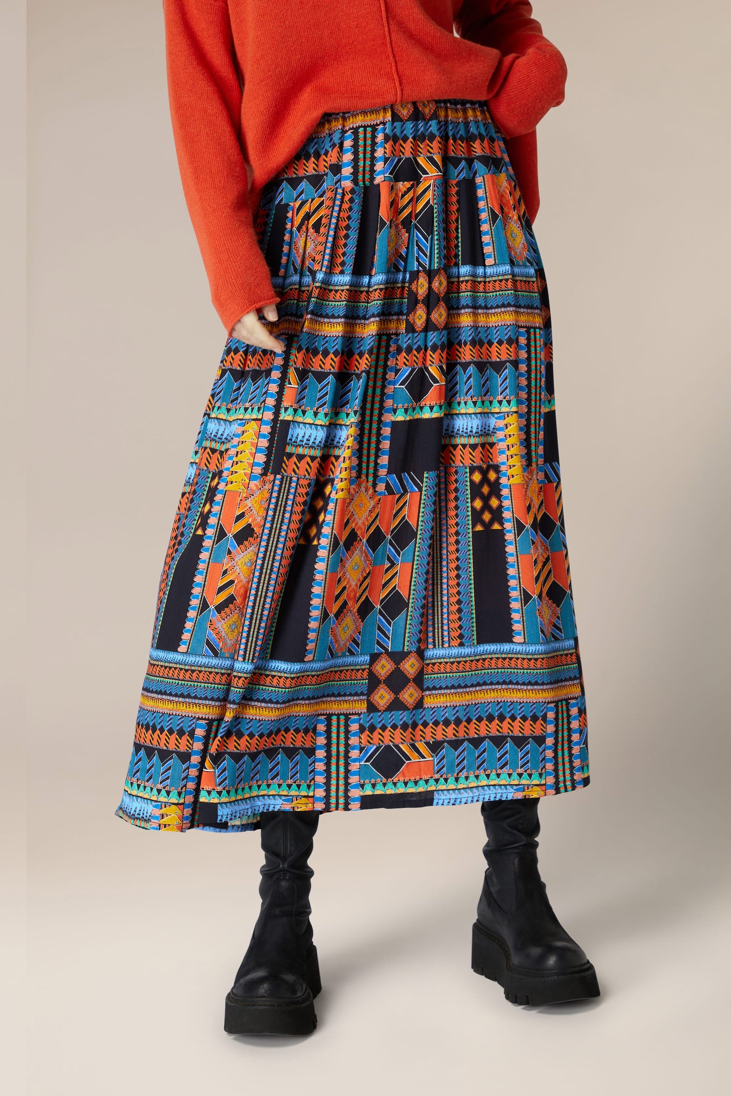 A woman wearing a Bold Graphic Printed Skirt.