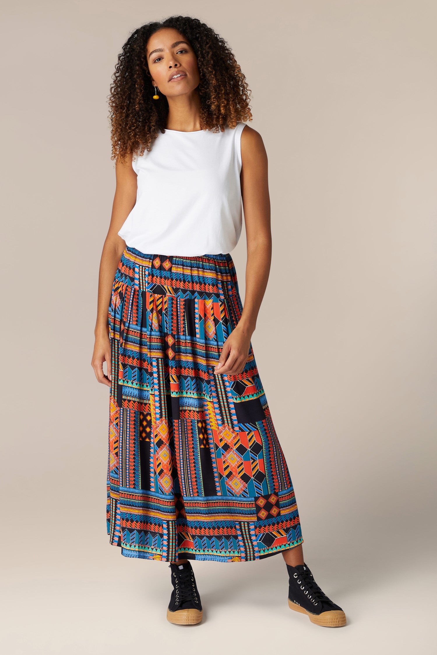 A woman wearing a Bold Graphic Printed Skirt.