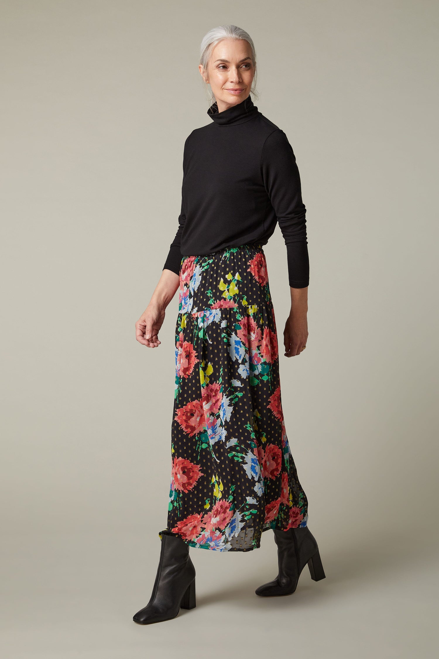 A woman wearing a Vintage Floral Bouquet Skirt.