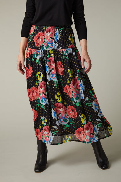 A woman wearing a Vintage Floral Bouquet Skirt
