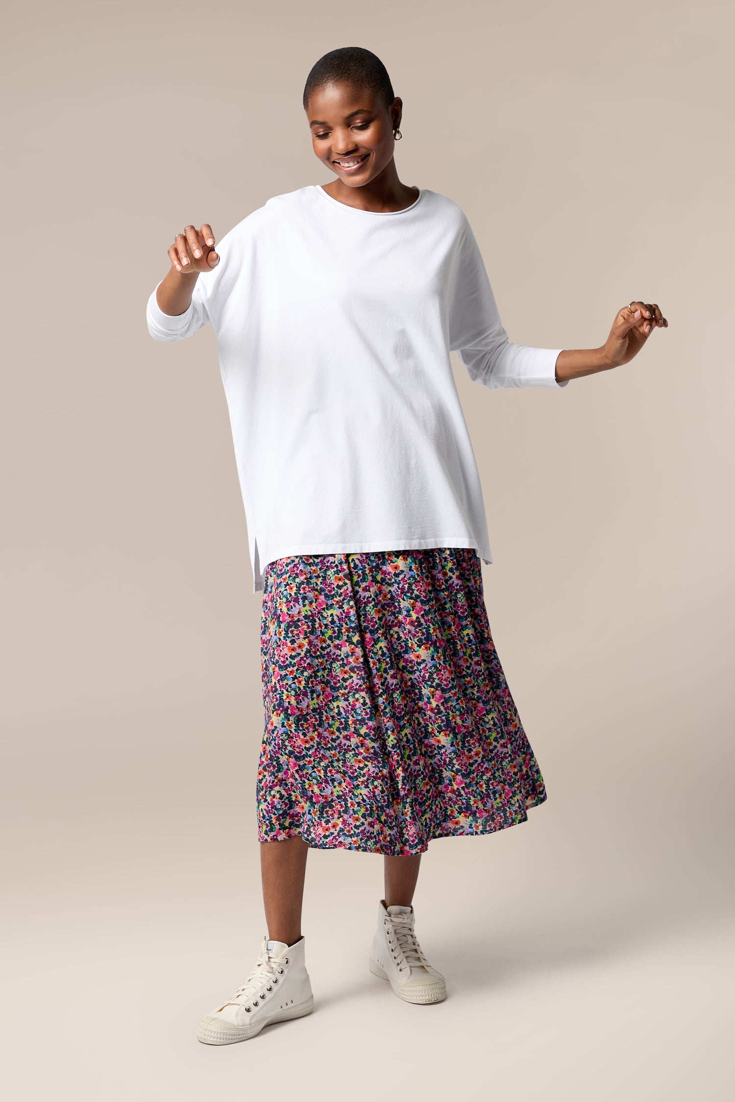 A woman wearing a Miniature Floral Garden Skirt.