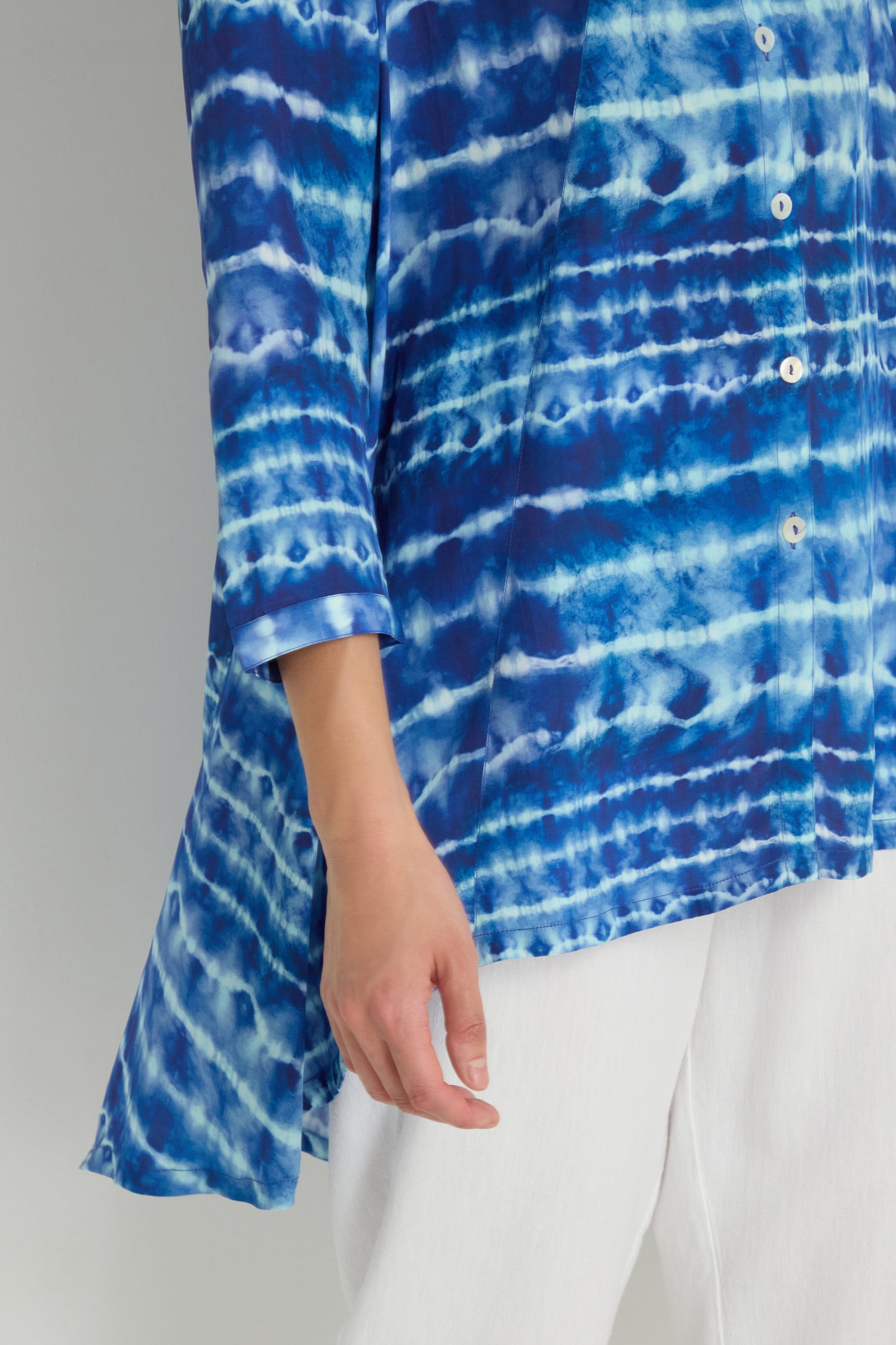 Model wears the Tie Dye Printed Viscose Shirt in blue and white with white pants, shown from shoulder to mid-thigh against a plain background.