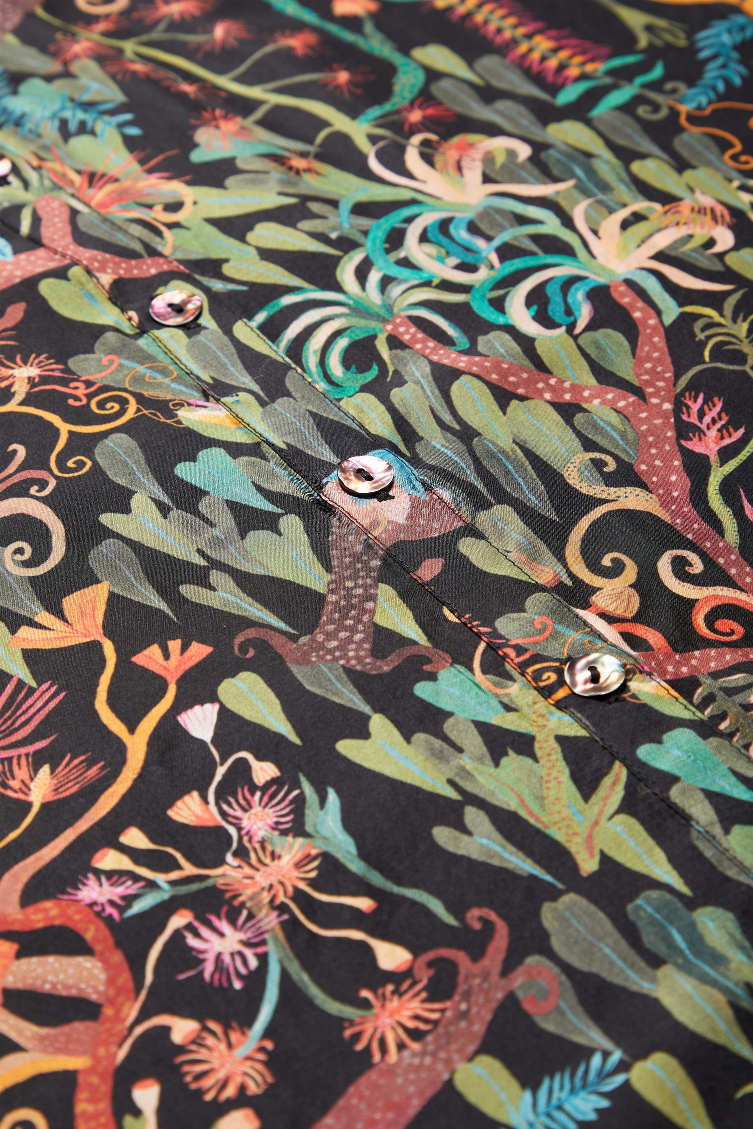 A Faraway Jungle Silk Boxy Shirt with a vibrant jungle print.