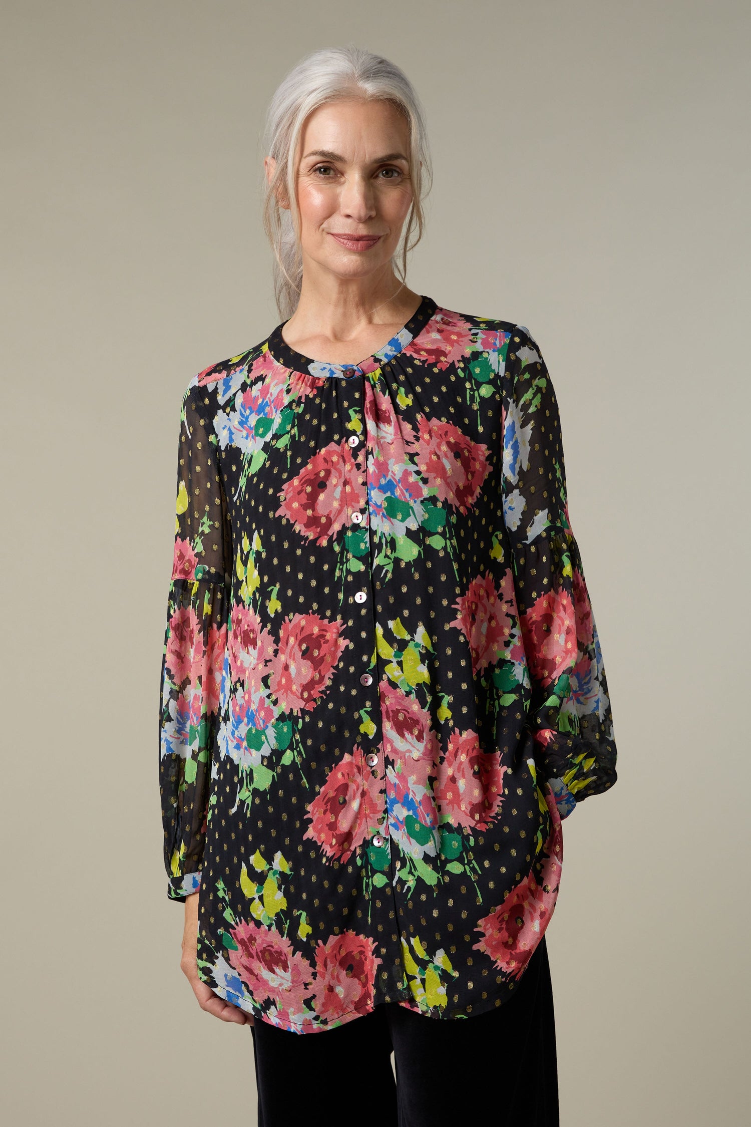 A woman wearing a vintage floral bouquet shirt.