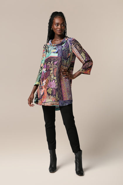 A woman wearing a Mythical Print Silk Tunic with intricate prints.