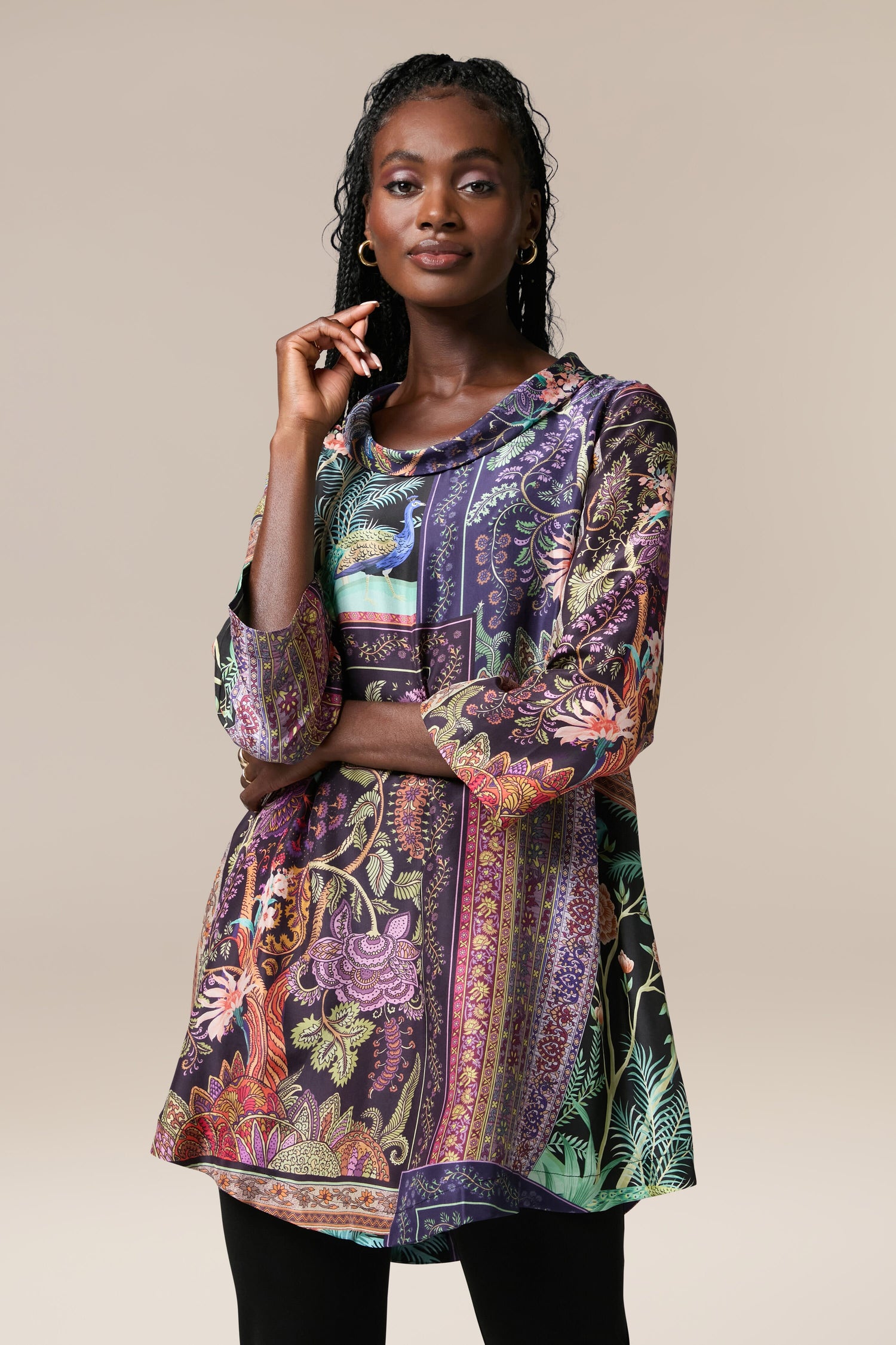 A woman wearing a Mythical Print Silk Tunic with intricate prints.