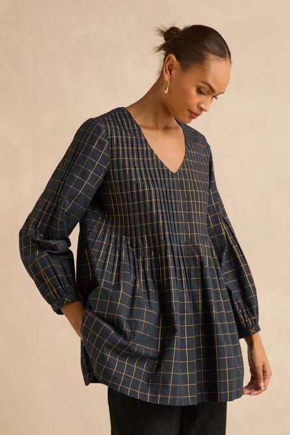 Lurex Check Pintuck Tunic in navy blue featuring a V-neck and pintuck detailing on the bodice.
