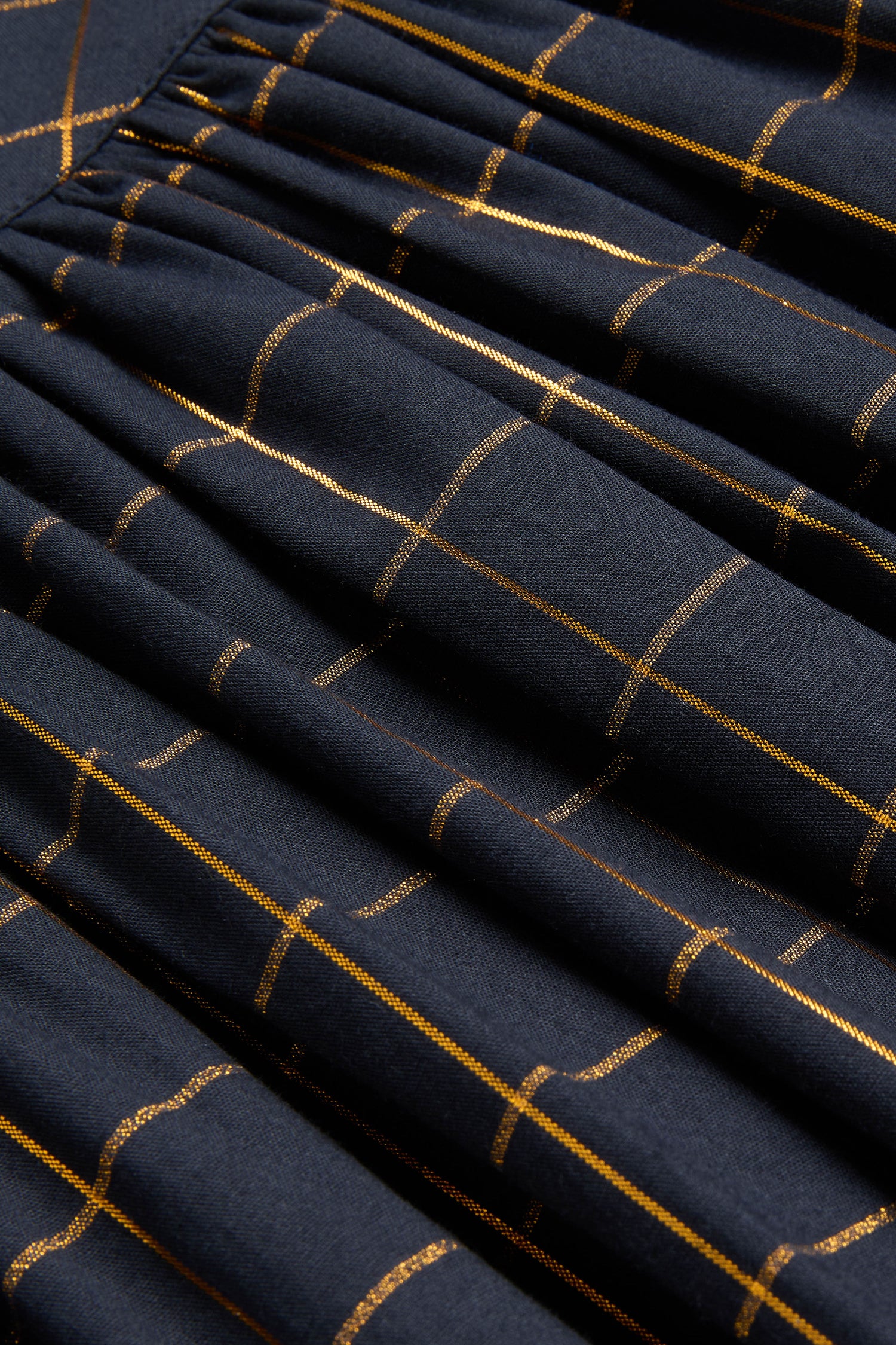 Lurex Check Pintuck Tunic in dark navy with gold metallic grid lines and gathered pintuck detailing.