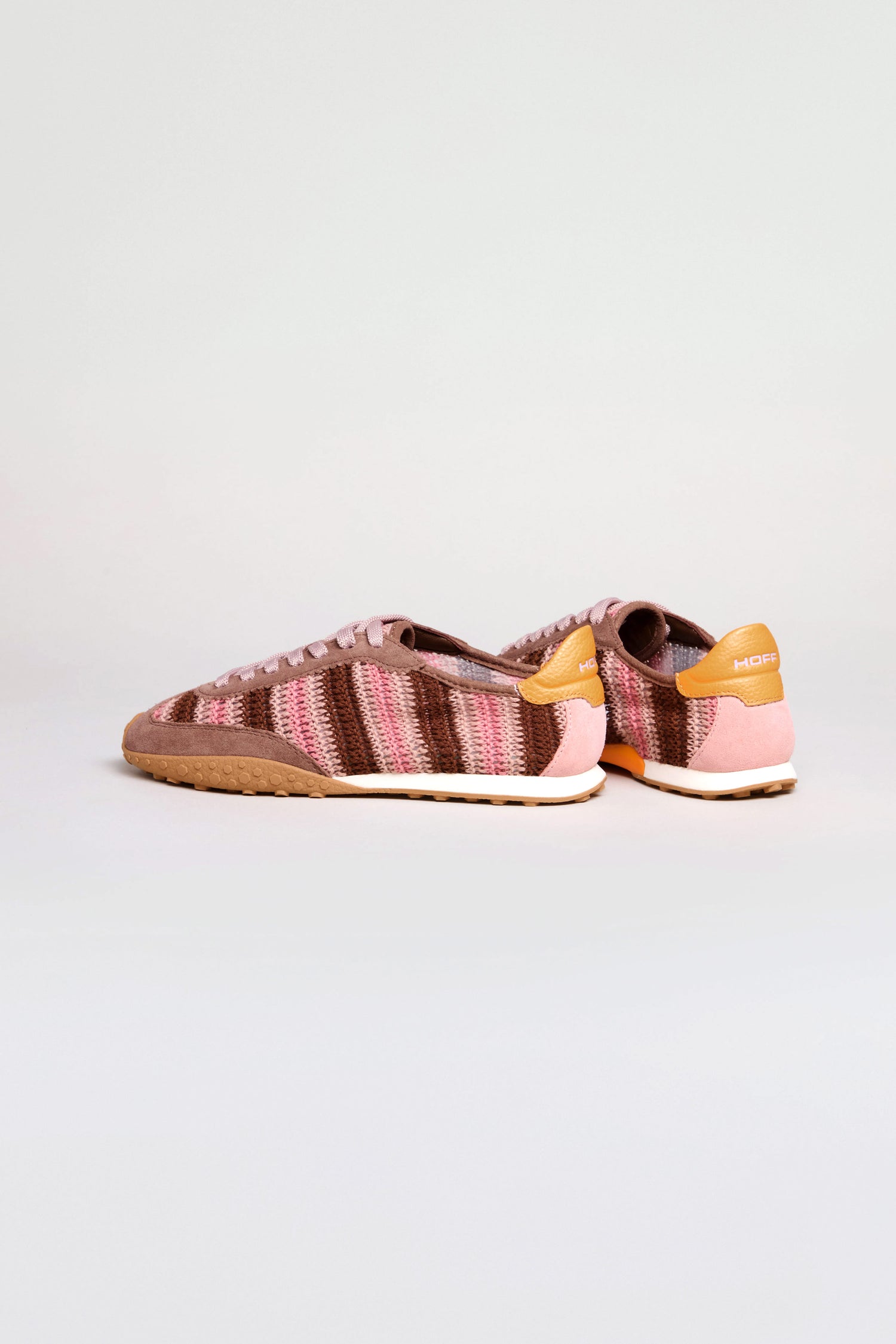 The Bridge Woven Brown Crochet Trainers feature leather panels in pink, brown, and orange with tan soles, and are displayed on a plain white background.