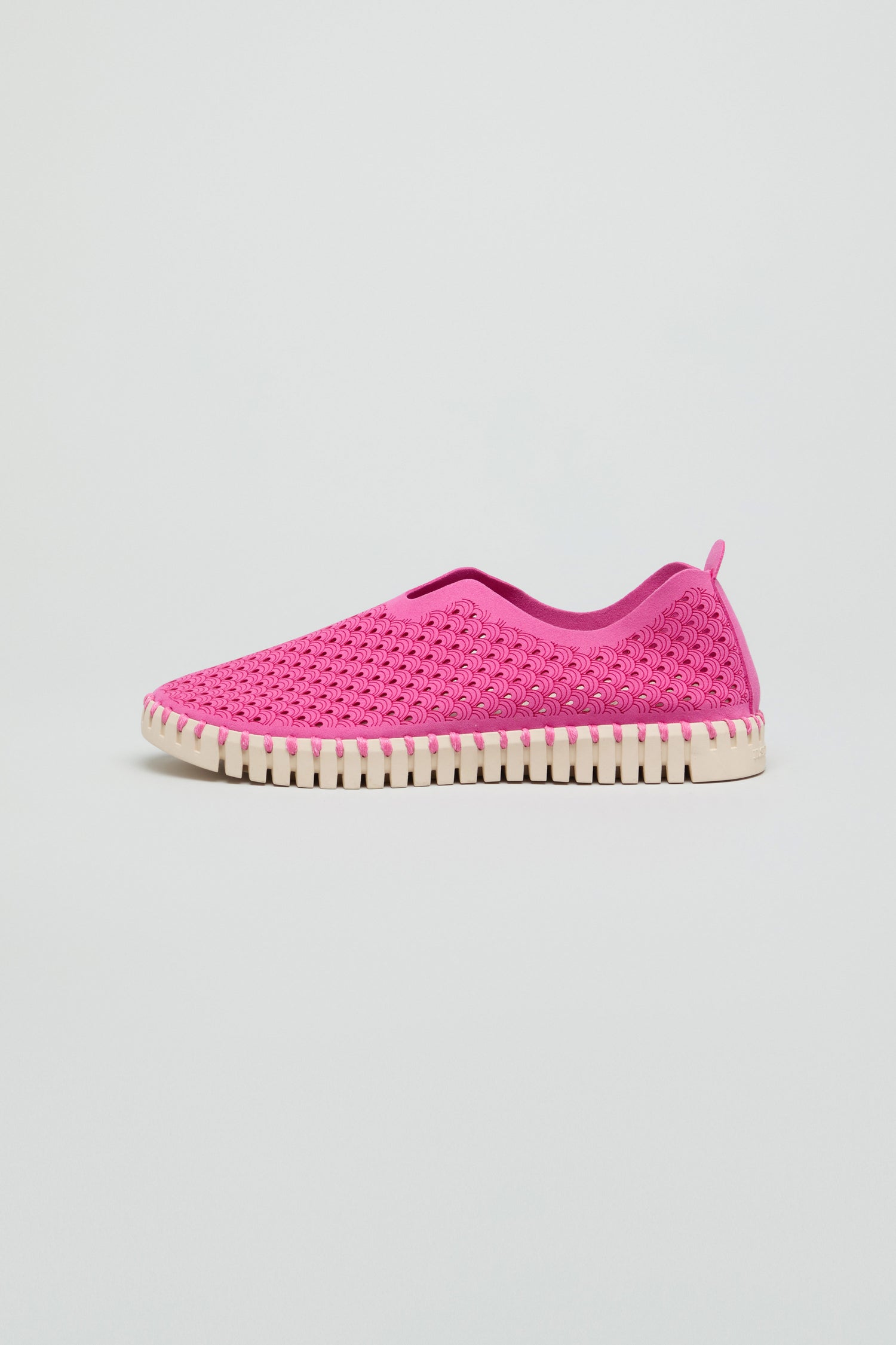 A single Rose Tulip Slip on Shoe, featuring a pink upper and white ridged sole, is showcased on a plain background, highlighting its lightweight comfort.
