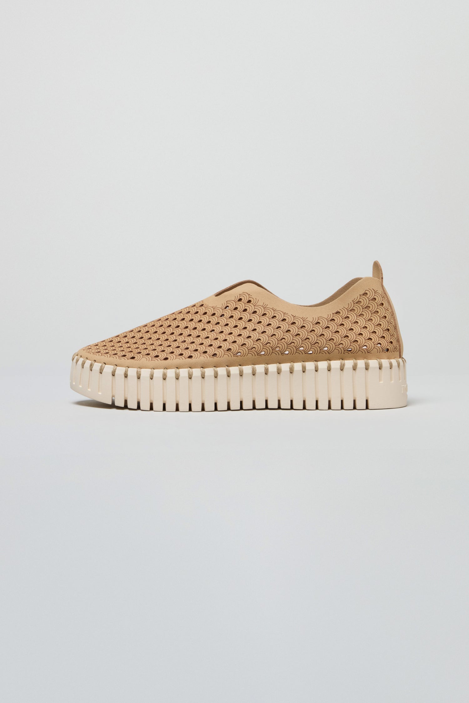 The Latte Tulip Platform Slip On Shoes feature a recycled microfibre beige upper and a thick, white ridged sole, displayed on a plain background.