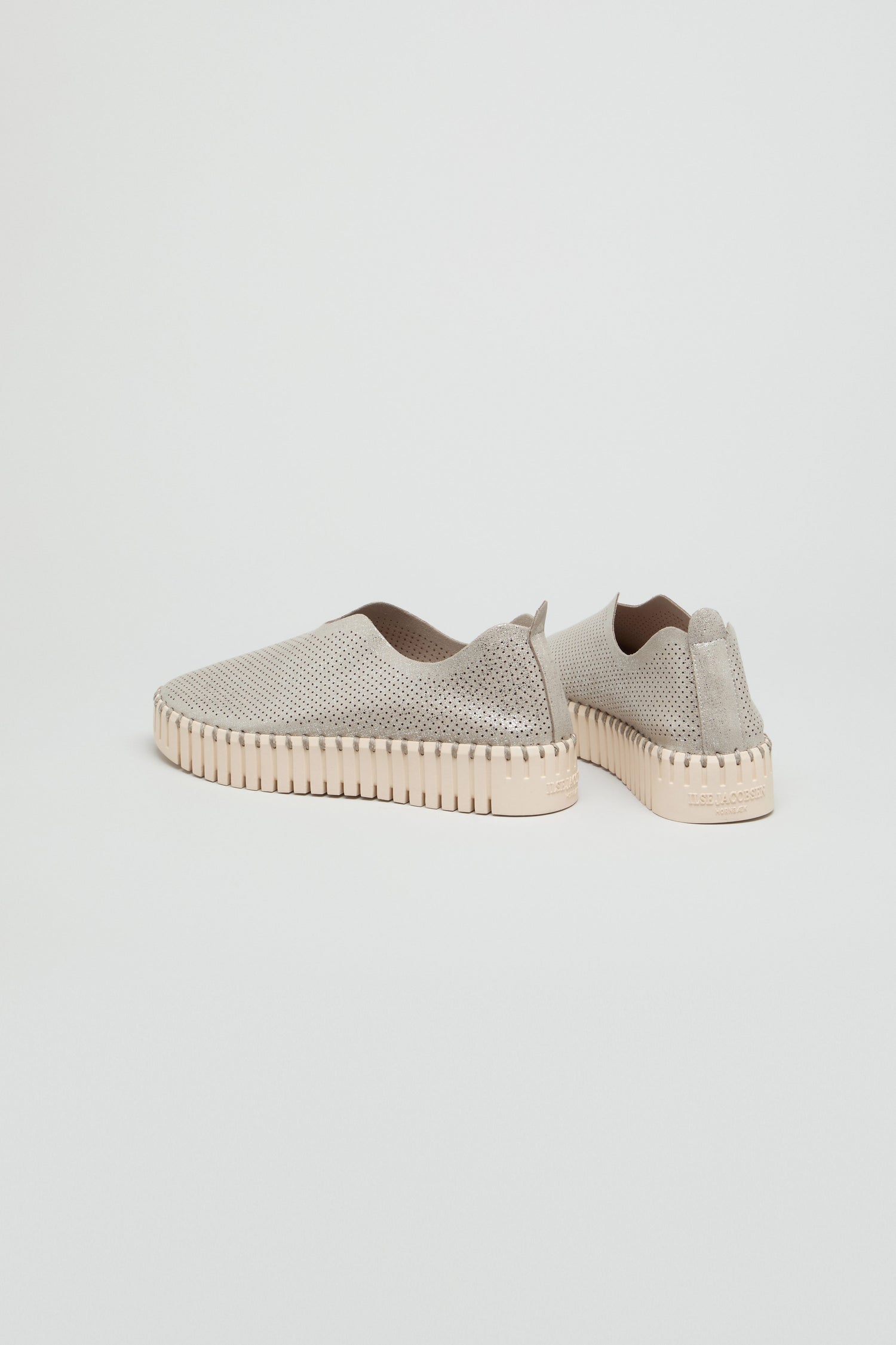 A pair of Tulip Glimmer Platform Slip on Shoes in light beige with perforated uppers and textured rubber soles, shown against a plain white background.