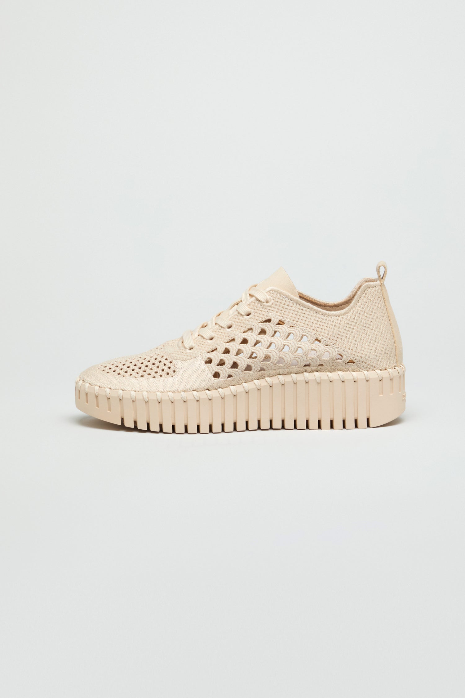The Tulip Embroidered Platform Lace Up Trainers feature a beige perforated knit upper, chunky textured sole, and lace-up closure, displayed in side profile against a plain light background.